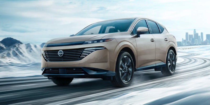 Nissan driving through mountains